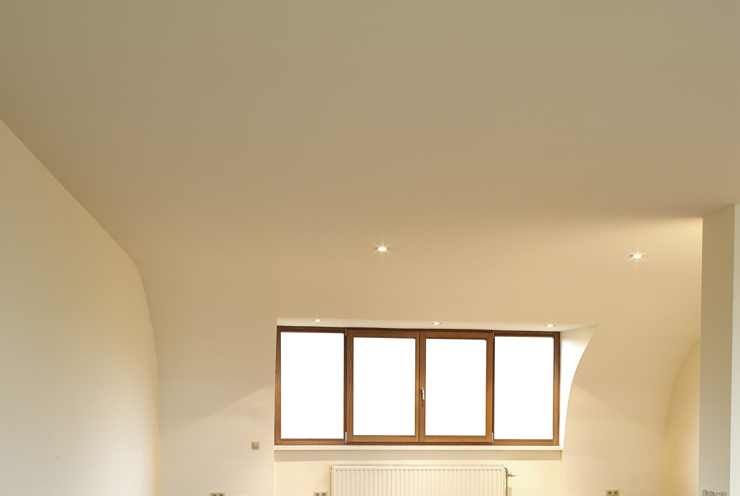 construction of the wooden frame of a roof Fibrerglass insulation installed in the sloping ceiling of a house. Construction of Drywall-Plasterboard Before and after